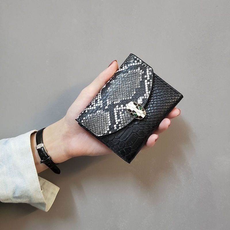(image for) Compact snake‑effect flap wallet with decorative clasp