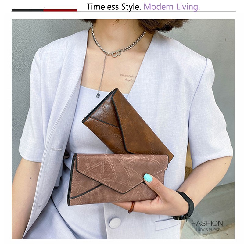 (imagen de) Cartera sobre con costuras geométricas y acabado vintage