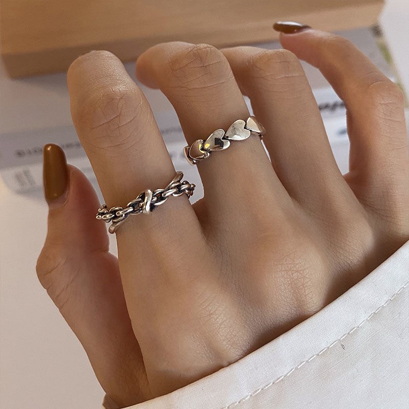 (imagen de) Set de anillos corazón y trenzado en tono plateado