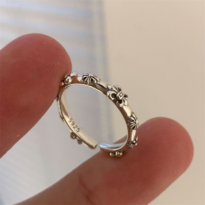 Silver-tone adjustable ring with floral…