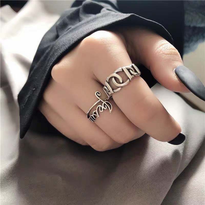 Silver-tone adjustable ring set with sc…