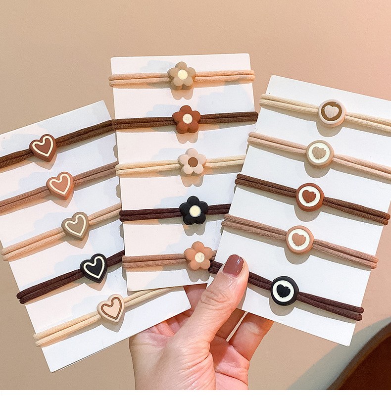 Hair ties with flower and heart charms, matte finish (image for) Hair ties with flower and heart charms, matte finish