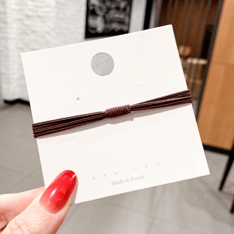(imagen de) Pack de gomas elásticas para cabello con nudo central