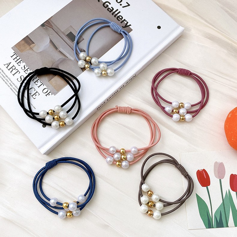 (imagen de) Goma elástica con perlas y cuentas doradas