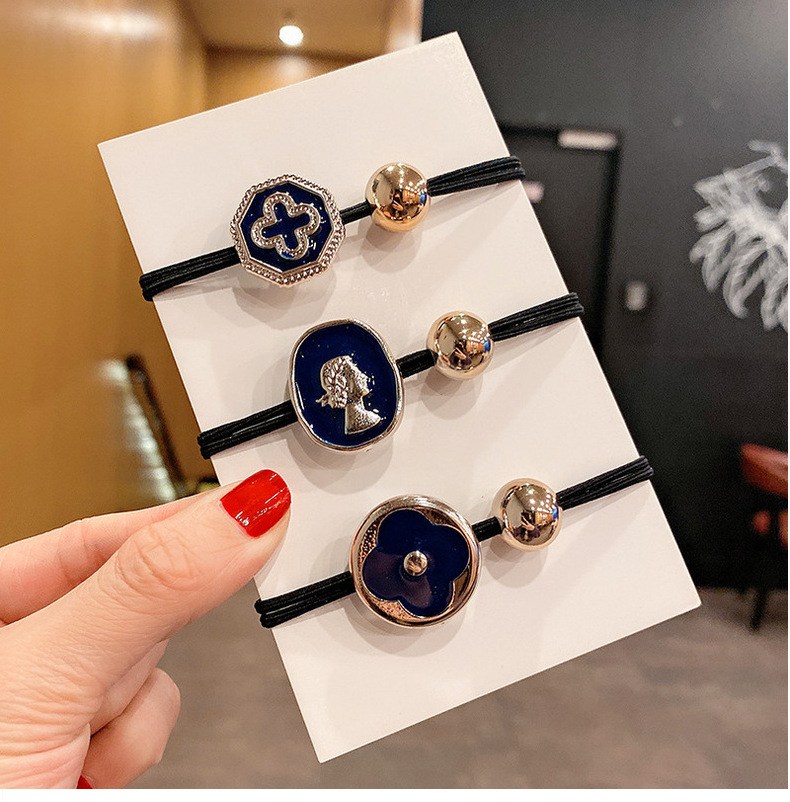 Decorative medallion hair ties with metallic beads (image for) Decorative medallion hair ties with metallic beads
