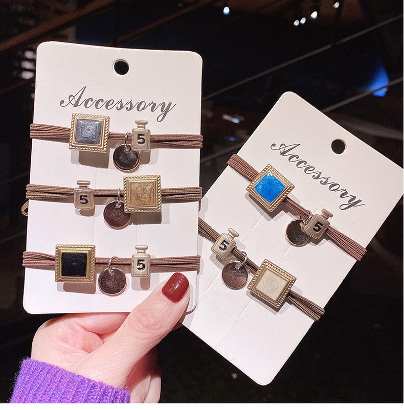 Brown elastic hair ties with square charm and '5' pendant (image for) Brown elastic hair ties with square charm and '5' pendant