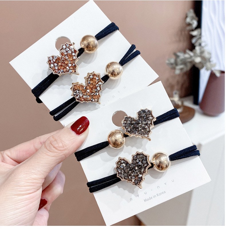 Elastic hair tie with crystal heart and metal bead (image for) Elastic hair tie with crystal heart and metal bead