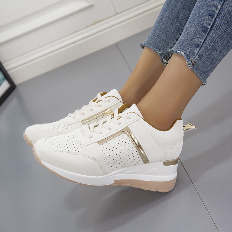 Wedge sneaker with perforated panels an…