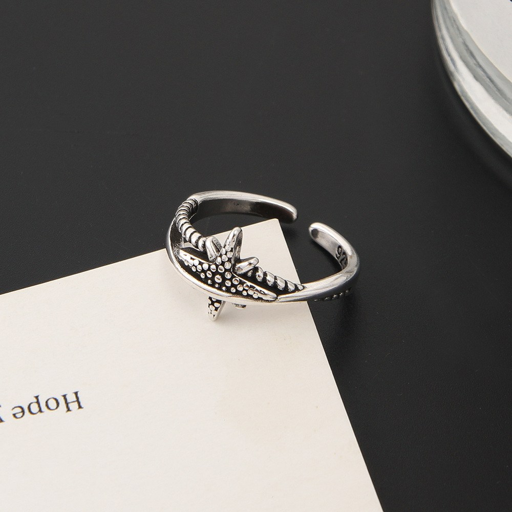 (imagen de) Anillo ajustable con estrella de mar en tono plateado