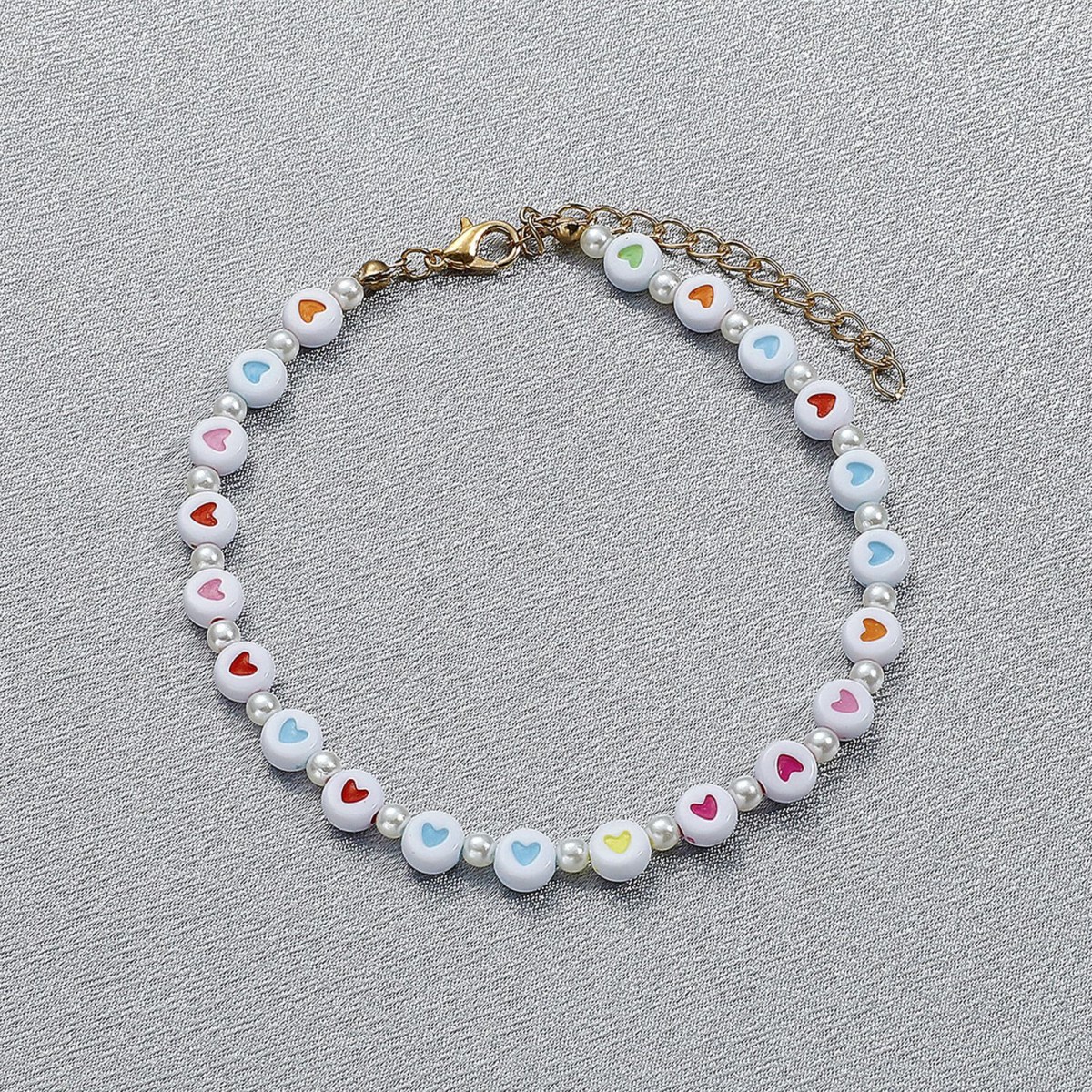(imagen de) Pulsera de perlitas con cuentas planas y corazones