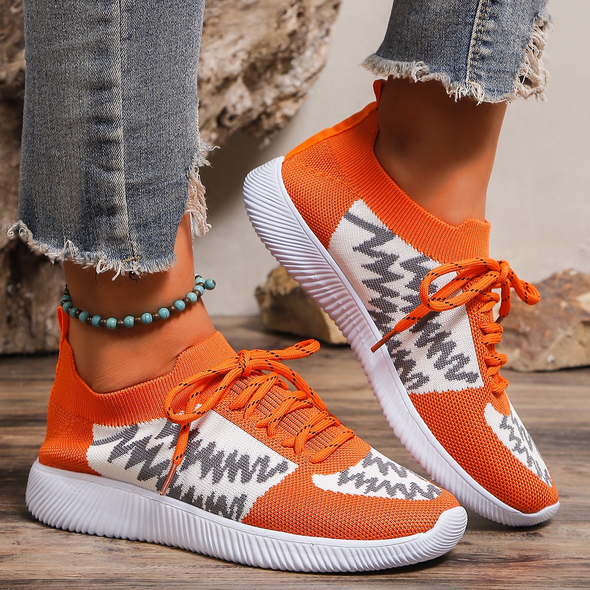 Orange sock‑knit athletic sneaker with ribbed sole (image for) Orange sock‑knit athletic sneaker with ribbed sole