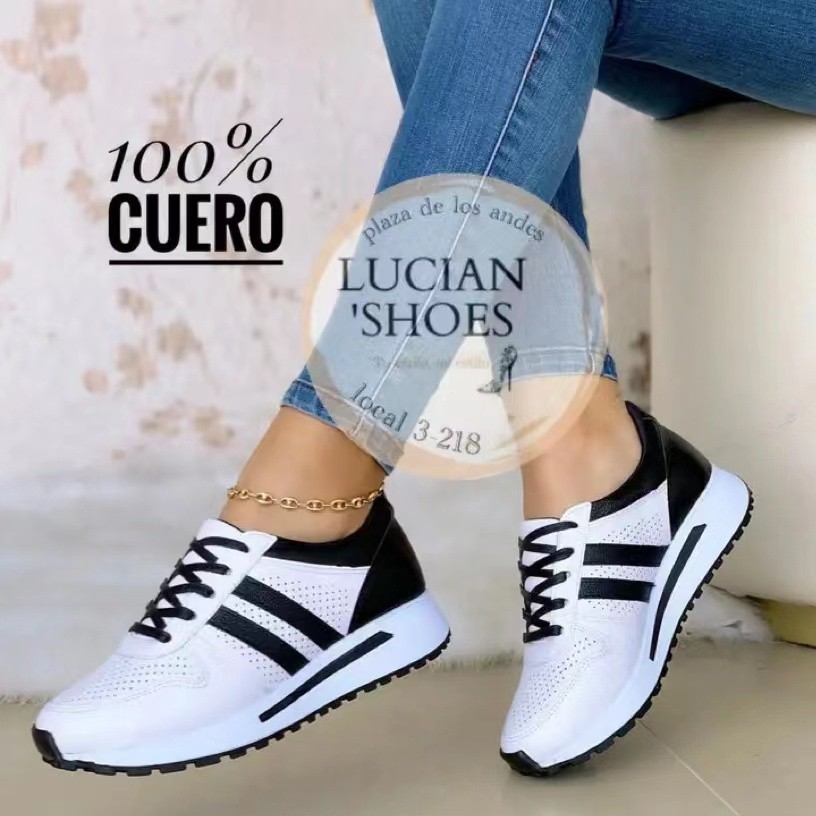 Zapatilla deportiva baja con franjas la…